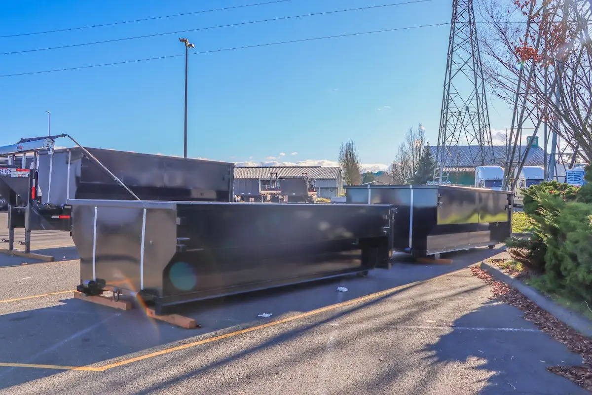 Roll-off dumpster ready for waste disposal at job site for Demolition Dumpster Rental in Northport